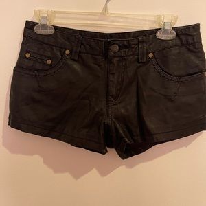 Free People Faux leather shorts black with slight tears size 2